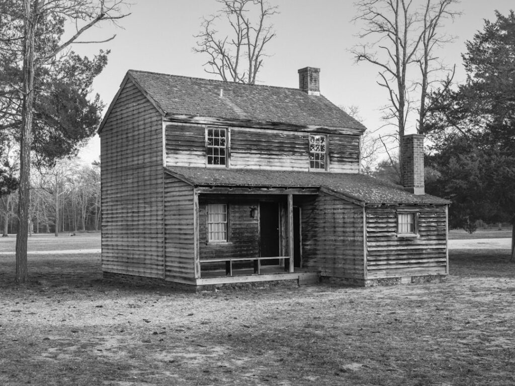 Older home with gray shingle-style asbestos cement siding on exterior walls