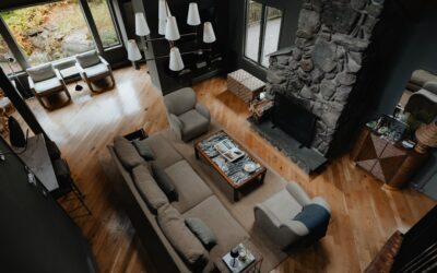Professional installer laying new carpet flooring in a spacious living room