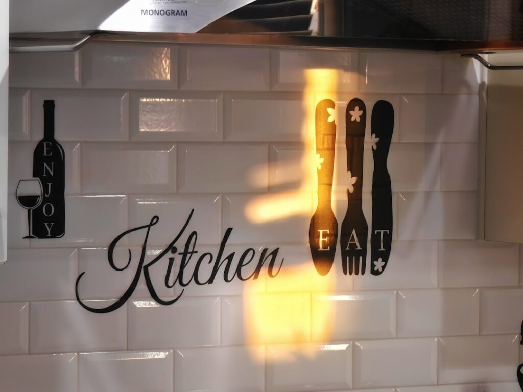 White subway tile backsplash in a modern kitchen with open shelving