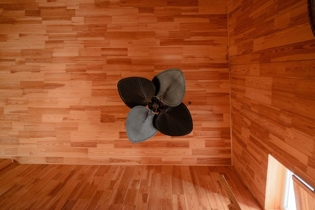 Modern bathroom with vinyl plank flooring in a light wood tone