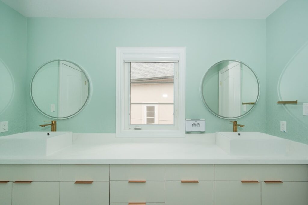 Newly renovated modern bathroom with tile flooring and updated fixtures