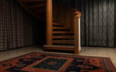 Neutral-toned carpet runner on a hardwood staircase in a bright home