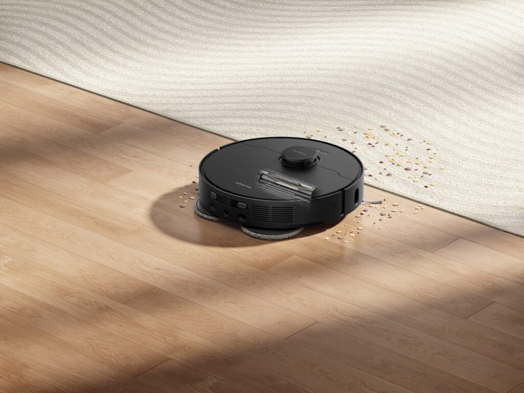 Upright vacuum cleaner being used on plush carpet in a living room