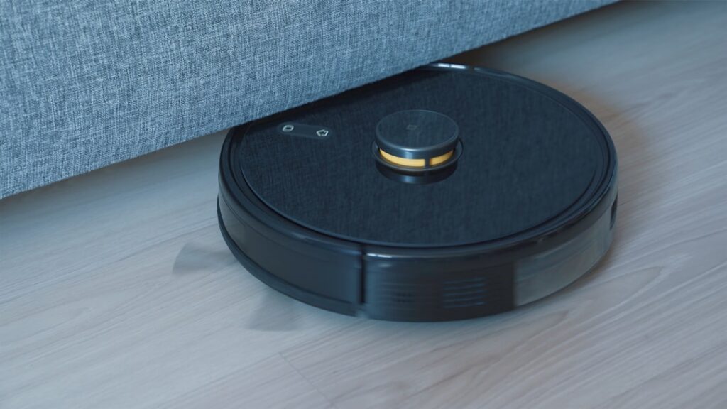 Upright vacuum cleaner being used on plush carpet