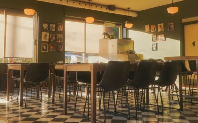 Classic black and white checkered vinyl floor in a bright retro-style kitchen