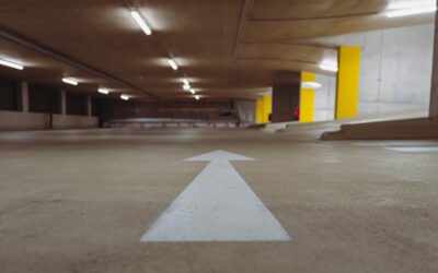 Glossy concrete floor coating in a modern residential garage