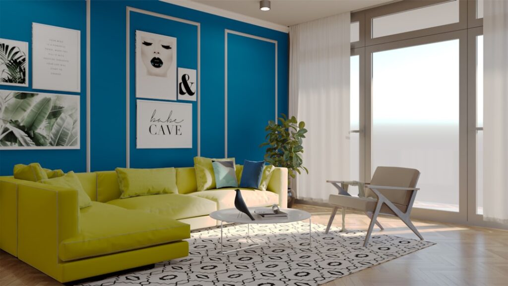 A serene living room with cool blue-gray walls and light gray hardwood flooring complemented by green plants