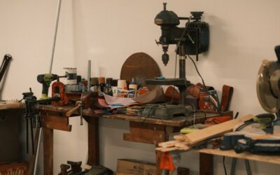 Person cutting laminate flooring plank on a miter saw