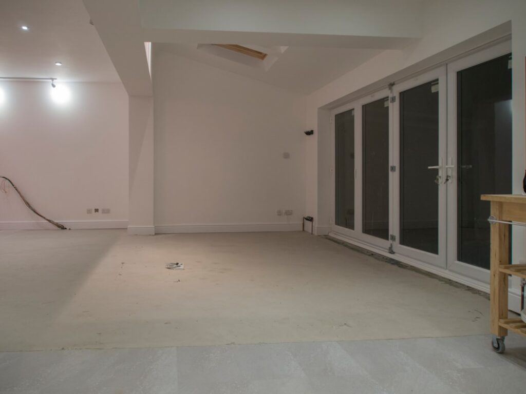 Homeowner installing click-lock vinyl plank flooring