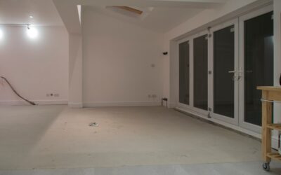 Homeowner installing click-lock vinyl plank flooring