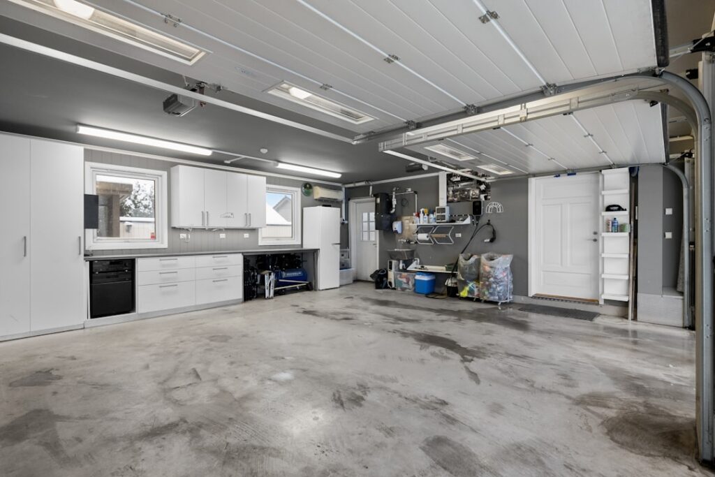 Metallic epoxy resin floor with a swirled grey pattern in a modern garage