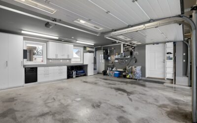Metallic epoxy resin floor with a swirled grey pattern in a modern garage