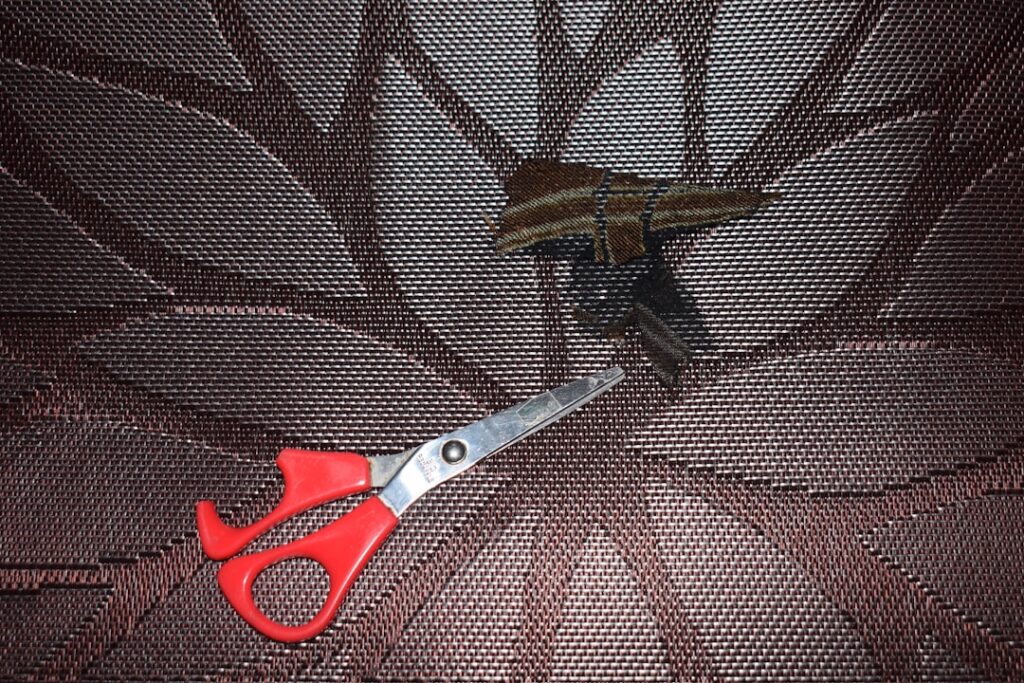 Professional carpet installer stretching carpet in a residential room
