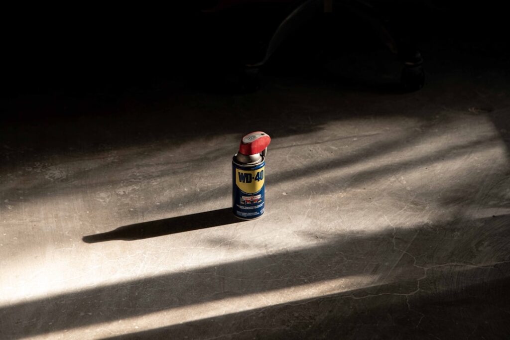 Split image showing garage floor paint on one side and epoxy coating on the other