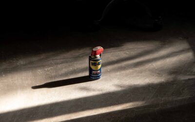 Clean garage with coated floor showing a car parked inside