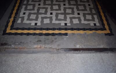 Interlocking garage floor tiles in a clean organized garage with tool storage