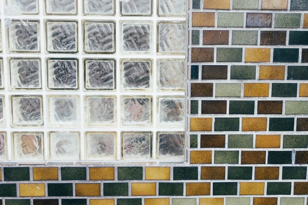 Blue glass mosaic tile backsplash in a modern kitchen
