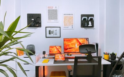 A well-organized modern home office with a standing desk, ergonomic chair, and light hardwood flooring