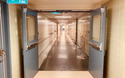 Clean hospital corridor with seamless vinyl flooring