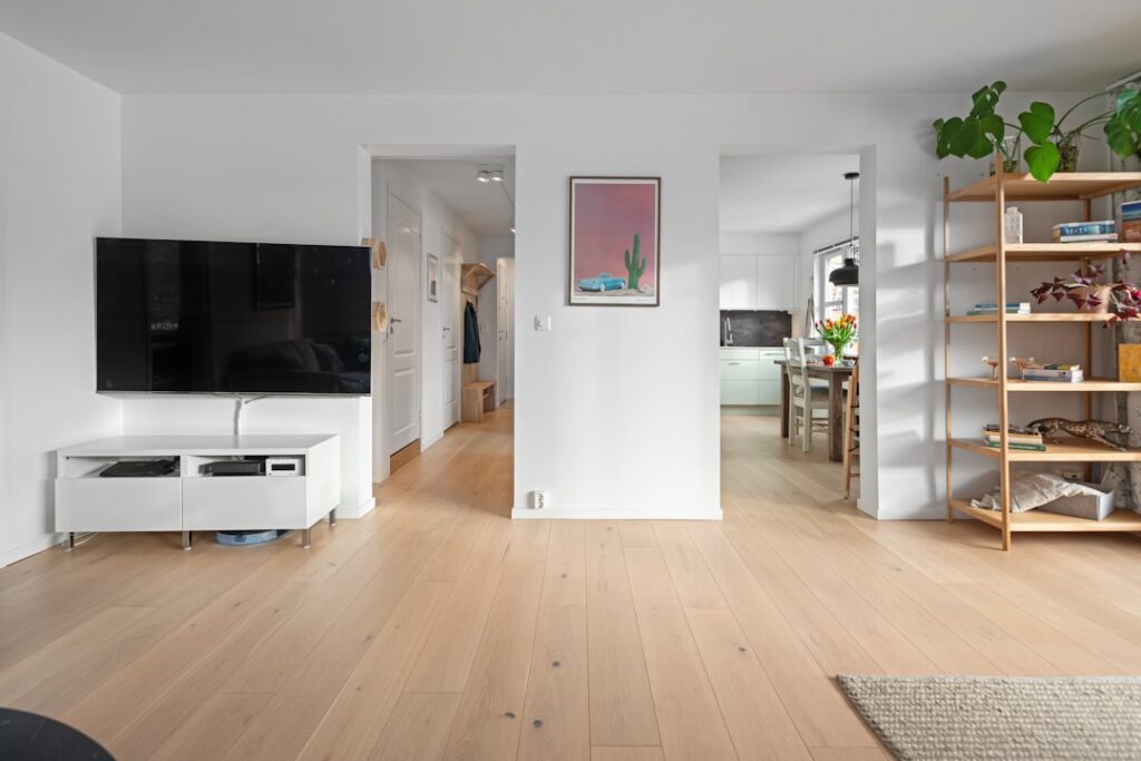 Clean vinyl plank flooring in a bright, modern kitchen