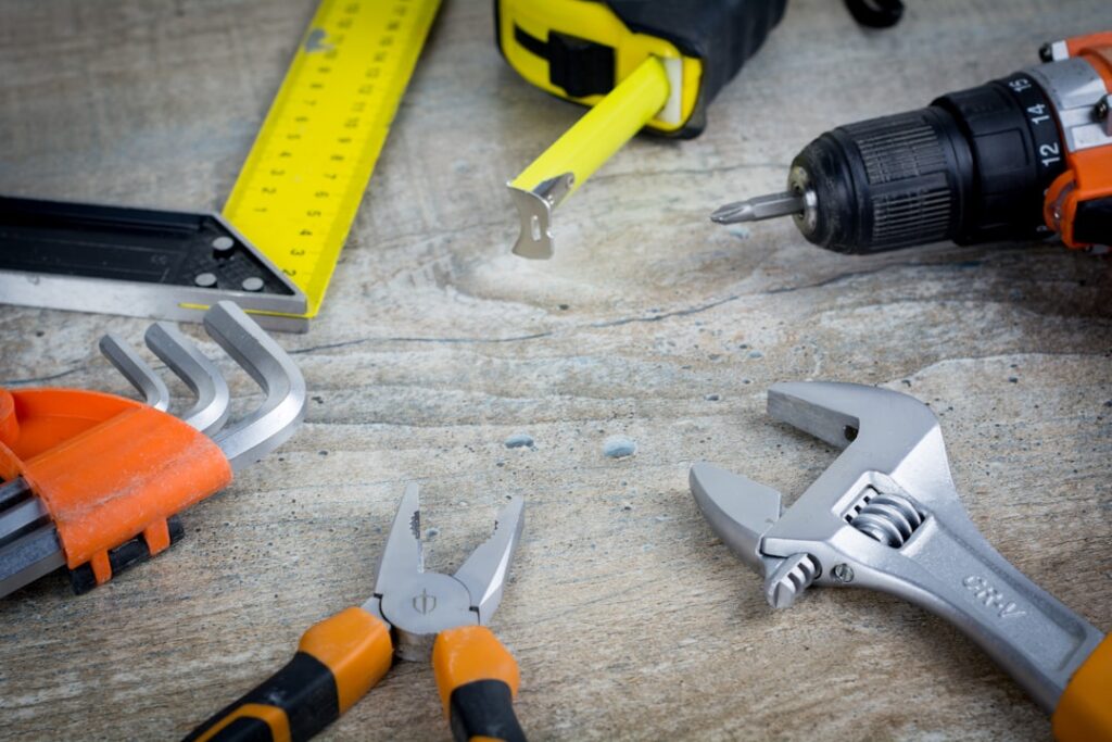 Laminate flooring planks being removed during a home renovation project