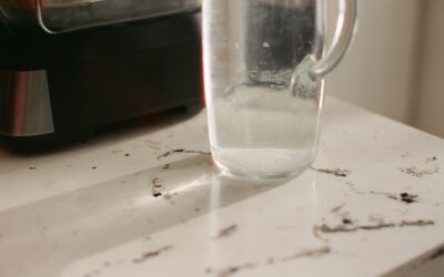 Close-up of water droplets on laminate flooring surface showing water resistance