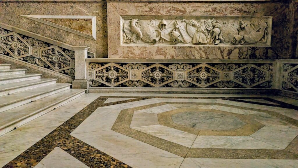 Elegant Italian marble flooring with white and gray veining in a grand entryway