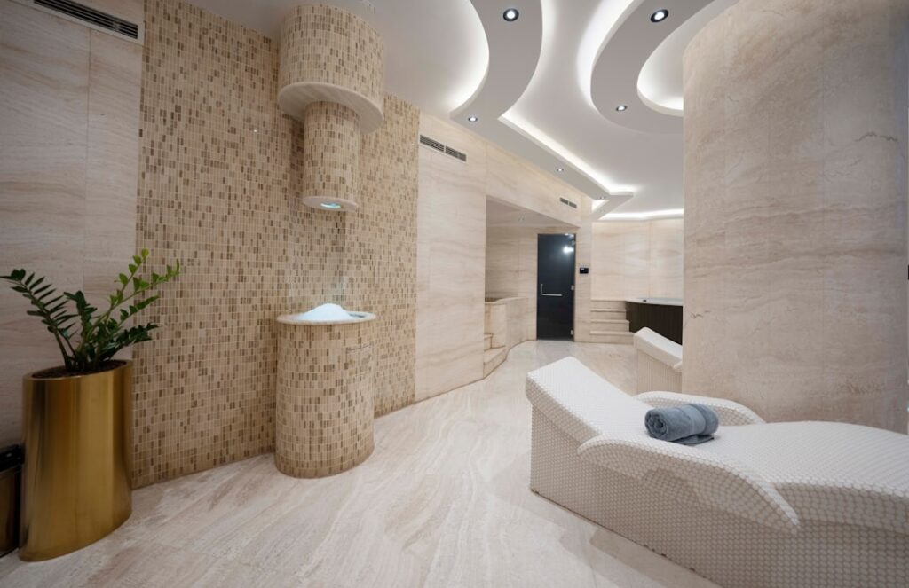 Modern bathroom with wood-look laminate flooring and white fixtures