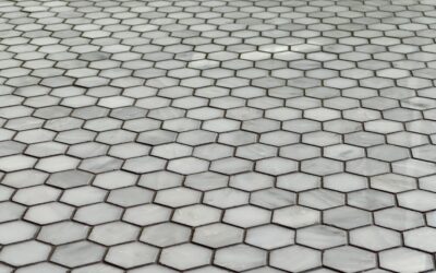 Laminate floor tiles with a realistic stone tile appearance in a bright kitchen