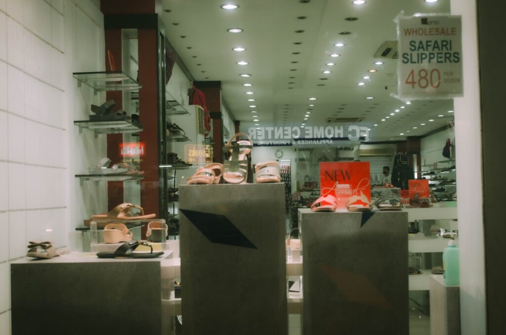 Laminate flooring display in a retail store with sale pricing signs
