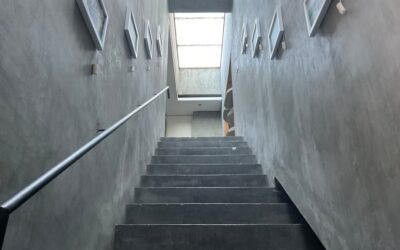 Laminate flooring installed on a staircase with matching stair nosing and risers