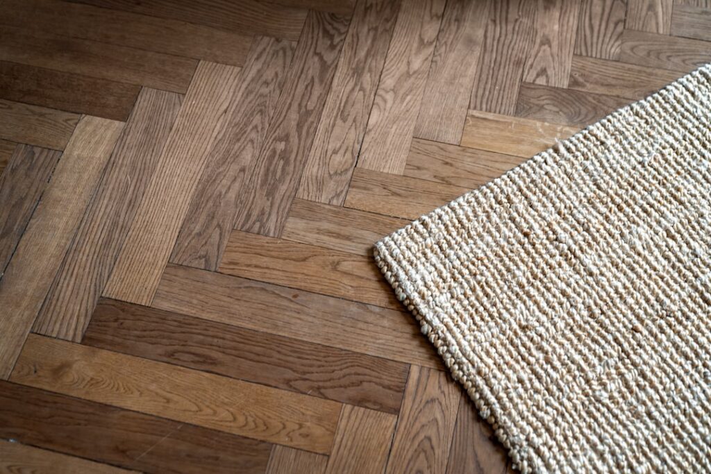 Roll of foam underlayment being laid on subfloor before laminate installation