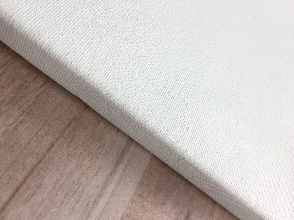 Side-by-side comparison of laminate and vinyl plank flooring samples