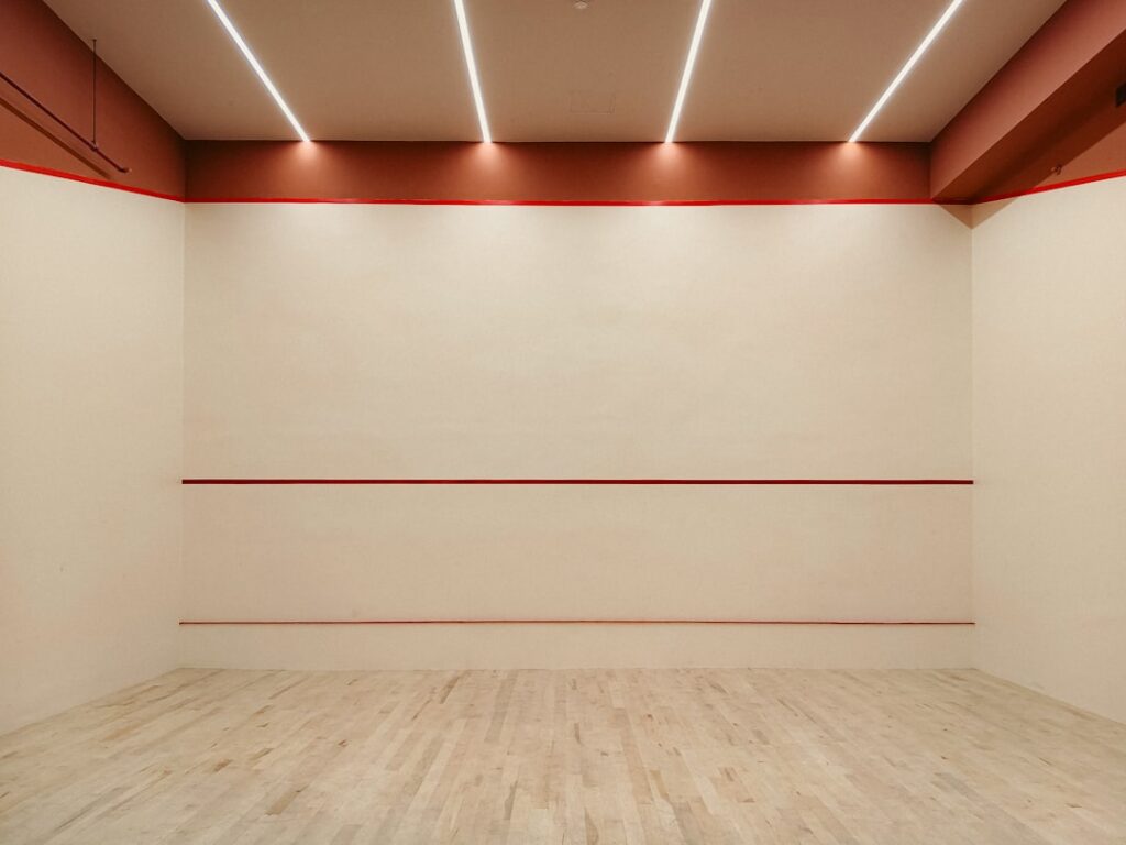 Perfectly smooth level 5 drywall finish on a wall ready for painting in a bright room