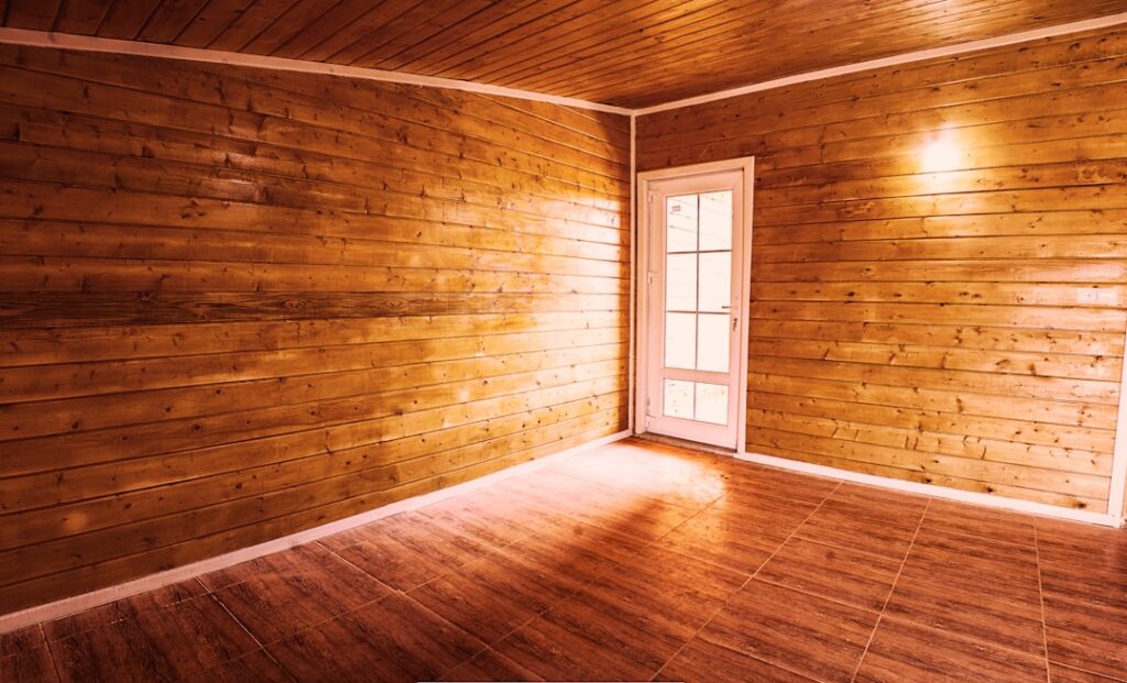 Light oak flooring in a bright modern living room with natural sunlight