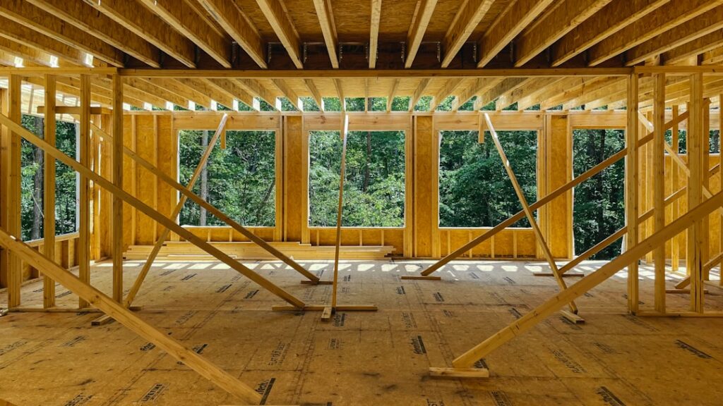Interior of a renovated home showing an exposed structural beam where a load bearing wall was removed
