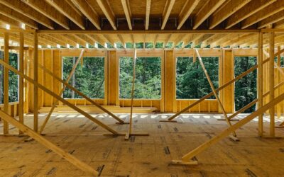 Interior of a renovated home showing an exposed structural beam where a load bearing wall was removed