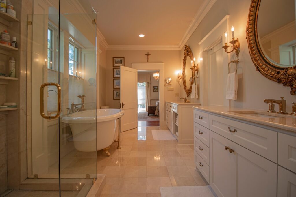 Elegant bathroom with white marble tile walls and floor featuring gray veining