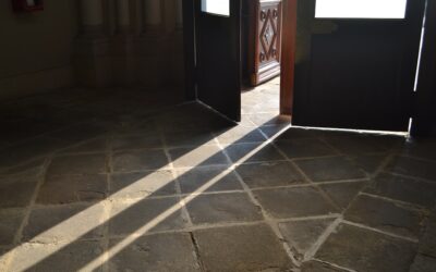 Marble-look luxury vinyl tile flooring in a bright modern bathroom