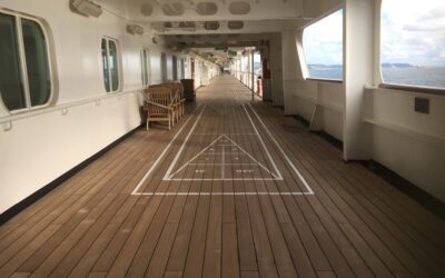 Marine vinyl flooring installed on a boat deck with teak-look pattern
