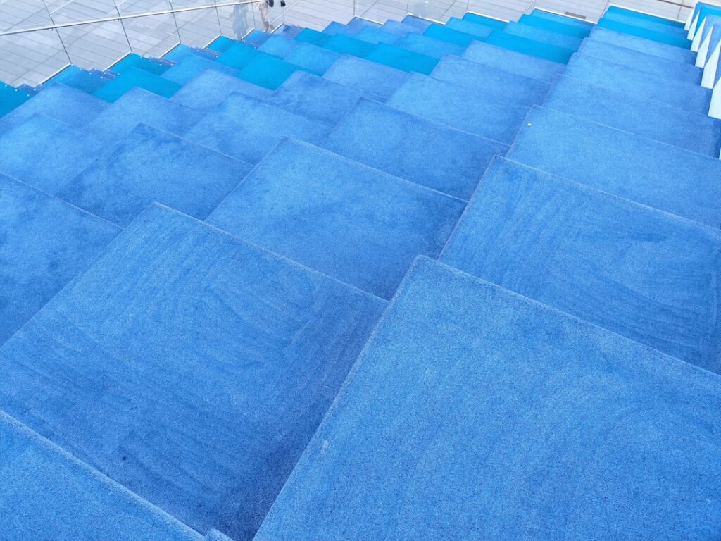 Polyethylene moisture barrier sheeting laid on a concrete subfloor