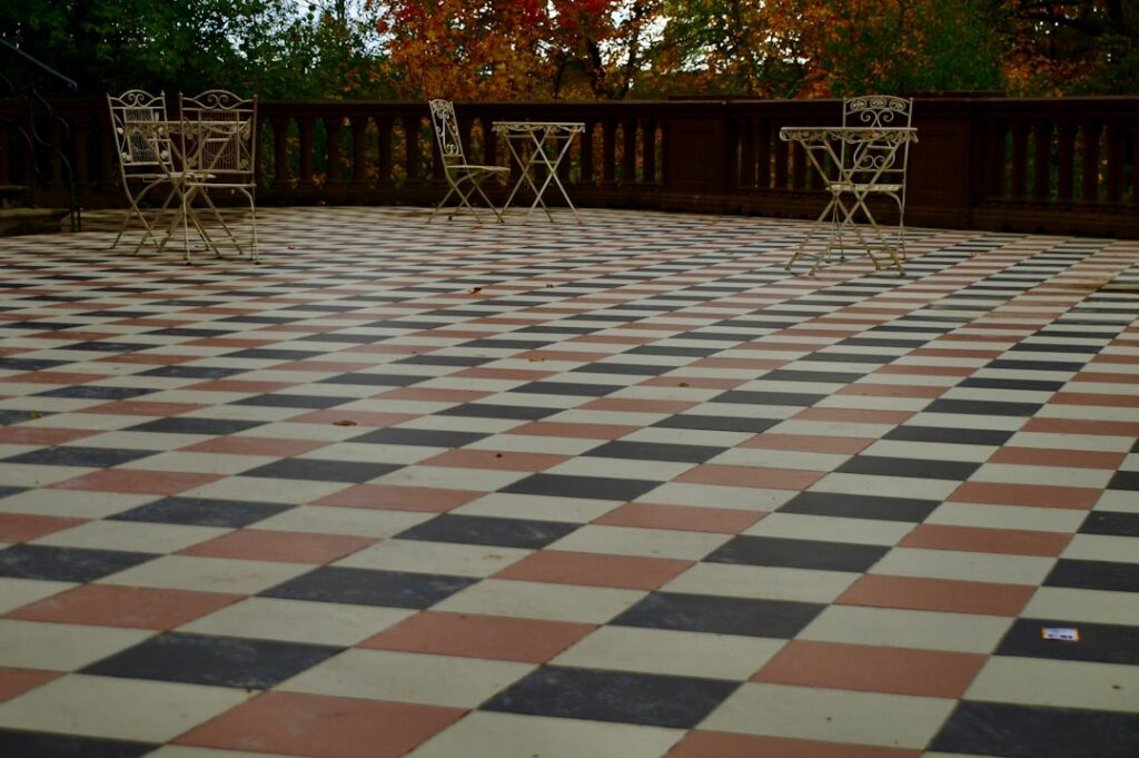 Porcelain paver tiles installed on an outdoor patio next to a pool