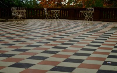 Porcelain paver tiles installed on an outdoor patio next to a pool