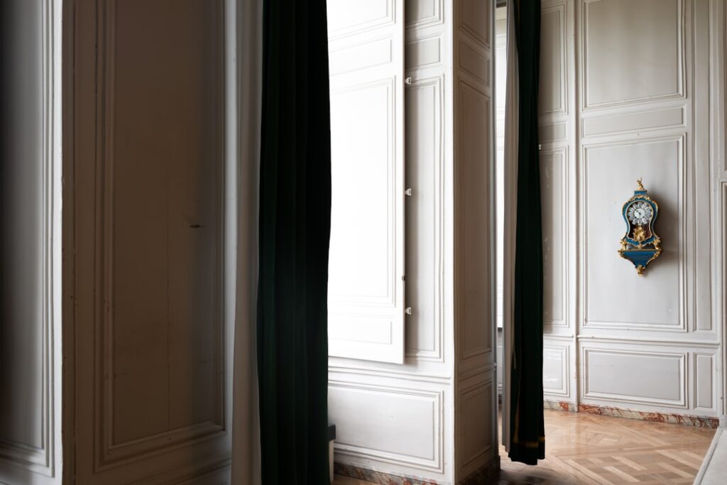 Full-length over the door mirror hanging on a white bedroom door