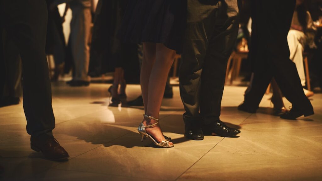 Portable dance floor set up at an outdoor wedding event with snap-together tiles
