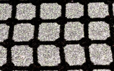 Black interlocking rubber floor mats installed in a home gym