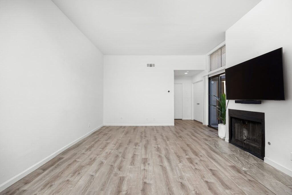 Cross-section view of soundproof flooring layers with underlayment on concrete subfloor
