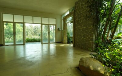 Stone-effect laminate flooring with a realistic slate look in a modern open-plan living area