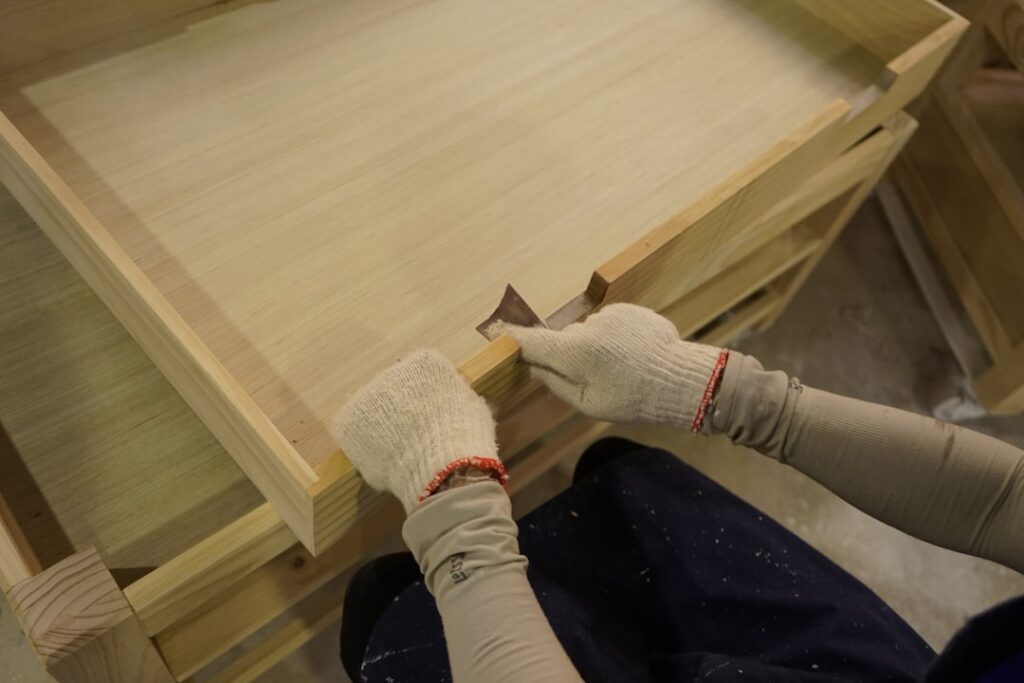 Plywood sub flooring being installed in a new home
