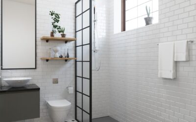 Small bathroom with large format light-colored tiles creating a spacious feel